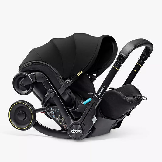 Black car seat with canopy on a white background