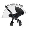 Black stroller with text 'Sit. Relax. Lay back.' on a white background